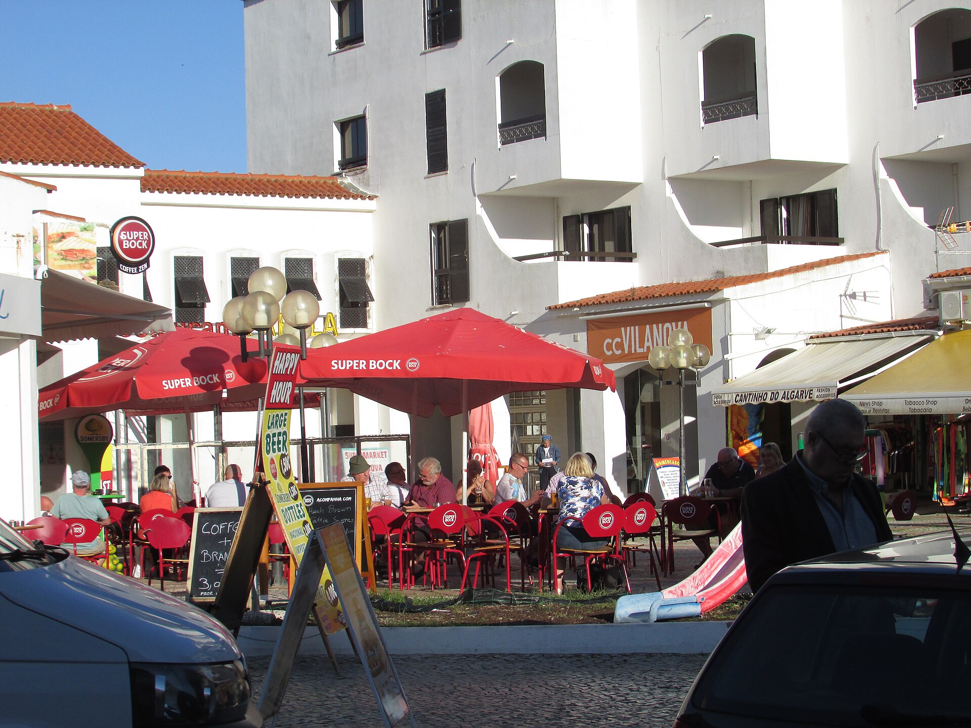 Bars and pavement tables along Avenida Sá Carneiro in Albufeira’s Oura district