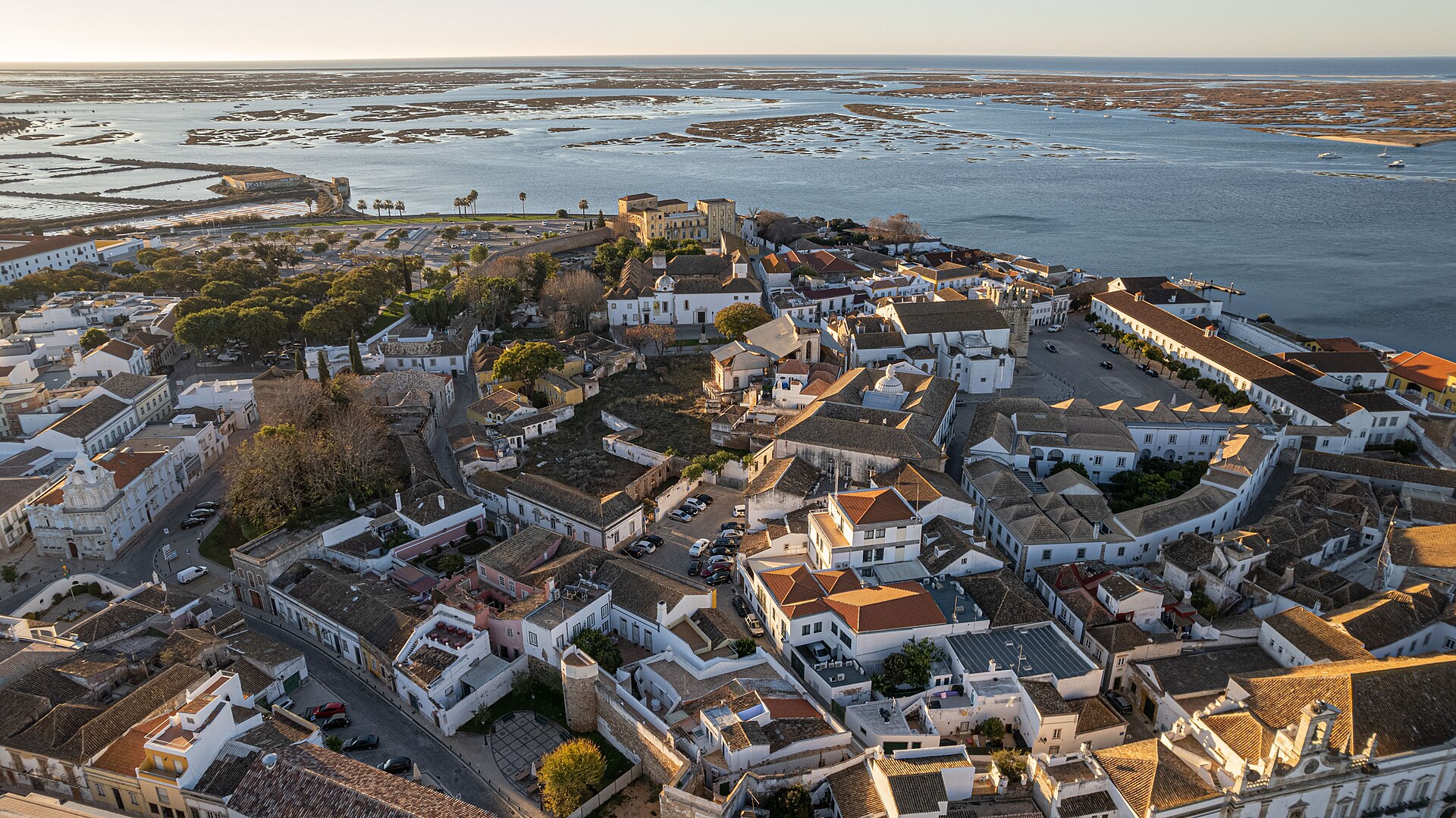 An aerial view across the tiled roofs and streets of Faro’s old town